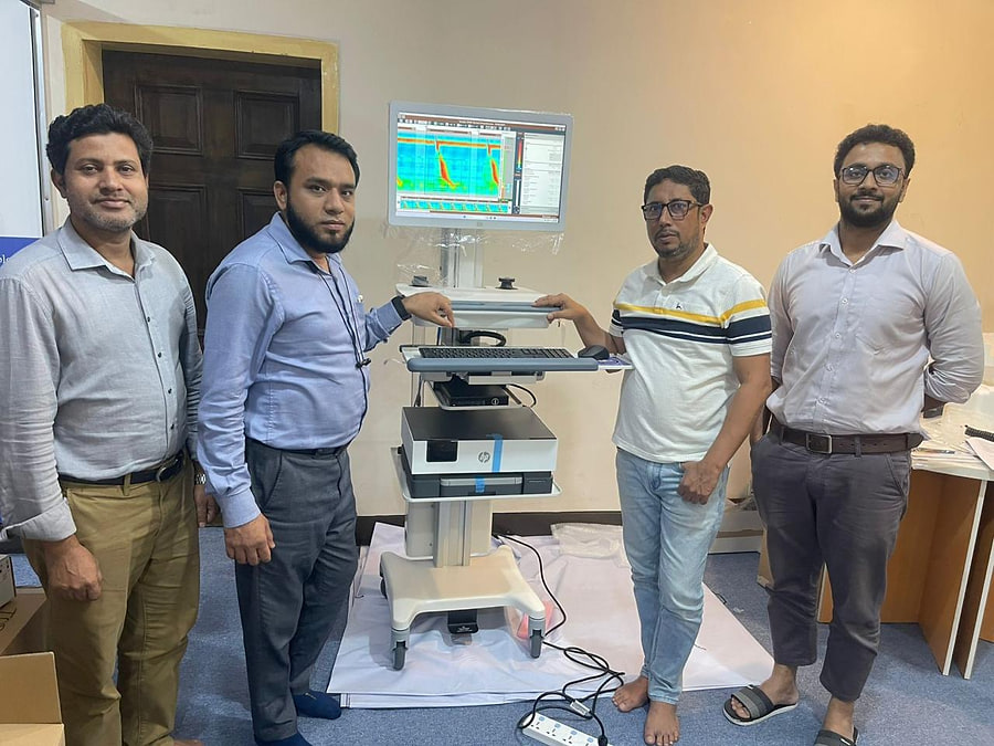 Engineers commissioning a diagnostic workstation on site